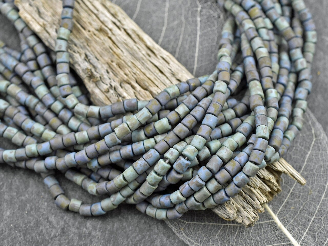 6/0 Aged Matte Turquoise Alabaster Picasso Bugle Beads (20" Strand)